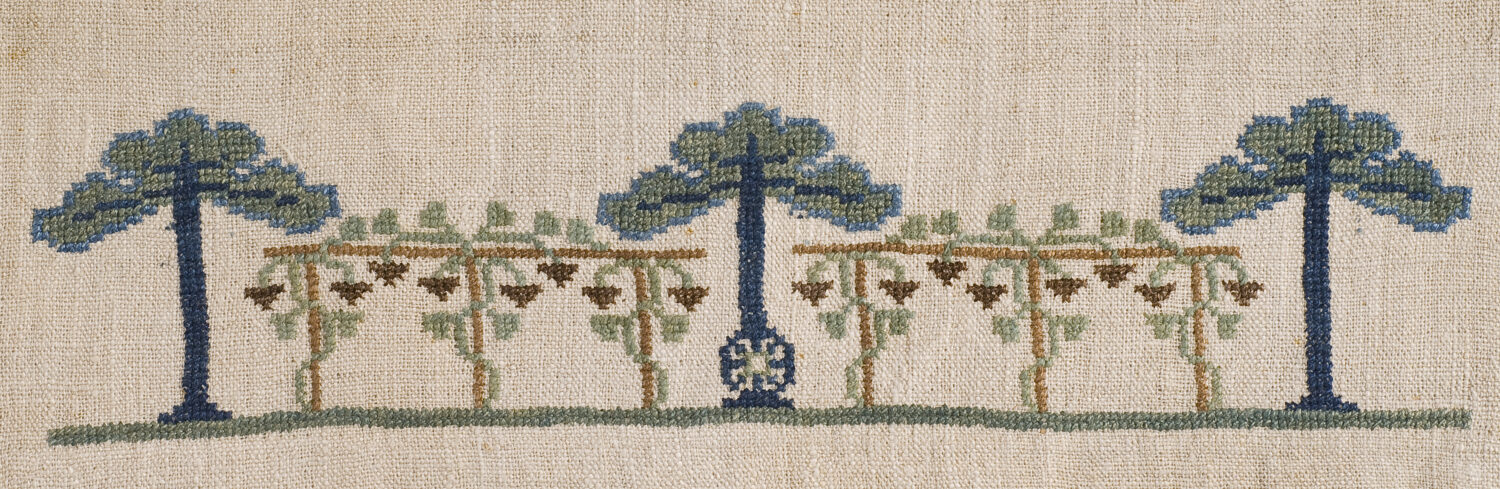Needlework of a vine and fig tree motif, c 1907